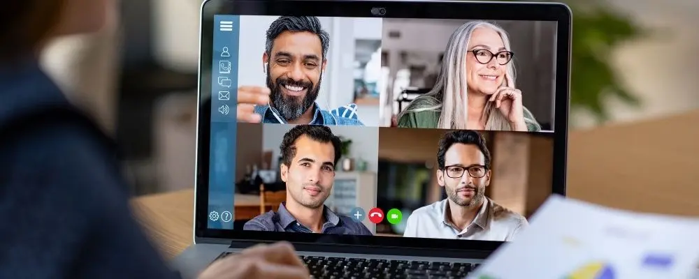 four people in a virtual meeting using remote interpretation